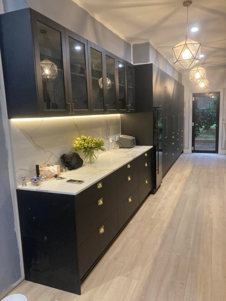 Custom matte black cabinetry and stone benchtop kitchen renovation Matraville